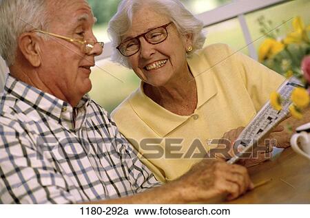 people, newspaper, couple, eyeglasses, senior, reading, puzzle View Large Photo Image Stock Image - people, newspaper, couple, eyeglasses, senior, reading, puzzle. Fotosearch