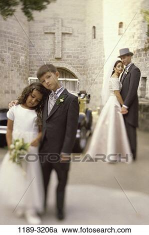 Stock Image - people, outdoors, wedding, church, bride, groom, flower girl. Fotosearch