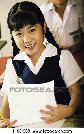 Stock Photo - people, paper, Asian, school, girl, child, education. Fotosearch