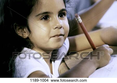 people, pencil, Hispanic, watch, girl, writing View Large Photo Image Picture - people, pencil, Hispanic, watch, girl, writing. Fotosearch
