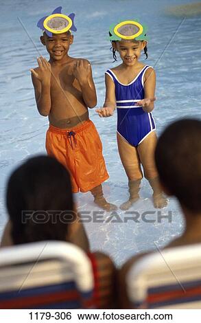 people, pool, gesturing, masks, outdoors, family, anticipation View Large Photo Image Stock Photograph - people, pool, gesturing, masks, outdoors, family, anticipation. Fotosearch