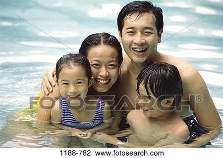 Stock Image - people, pool, smiling, Asian, swimming, family, vacation. Fotosearch