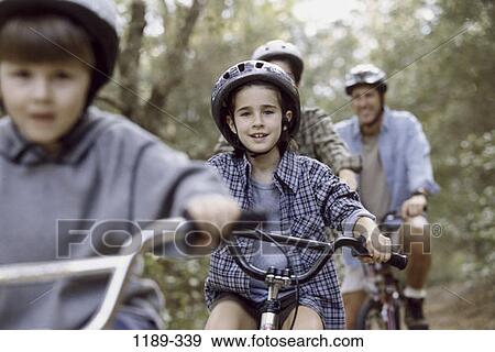 Stock Photo - people, riding, outdoors, bicycles, family, cycling. Fotosearch