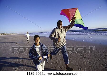 people, running, flying, beach, family, father View Large Photo Image Stock Image - people, running, flying, beach, family, father. Fotosearch