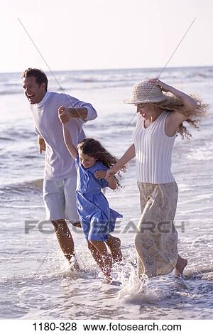people, running, hat, mother, beach, laughing, splash View Large Photo Image Stock Photo - people, running, hat, mother, beach, laughing, splash. Fotosearch