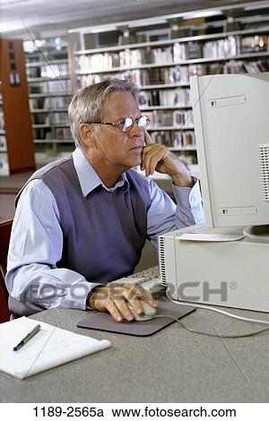 people, senior, computer, library, concentrating, research View Large Photo Image Stock Image - people, senior, computer, library, concentrating, research. Fotosearch