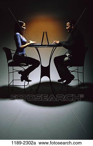 people, shadows, table, couple, Hispanic, typing, chairs View Large Photo Image Stock Image - people, shadows, table, couple, Hispanic, typing, chairs. Fotosearch