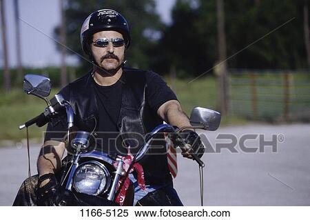 people, sitting, helmet, driving, motorcycle, sunglasses View Large Photo Image Stock Photography - people, sitting, helmet, driving, motorcycle, sunglasses. Fotosearch