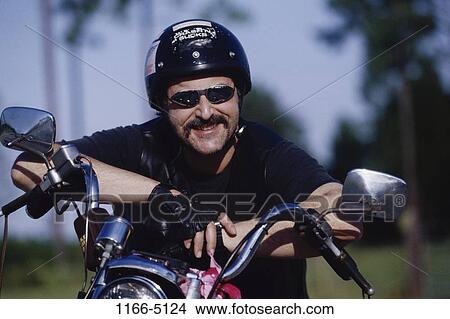 people, sitting, helmet, motorcycle, sunglasses, leaning View Large Photo Image Picture - people, sitting, helmet, motorcycle, sunglasses, leaning. Fotosearch