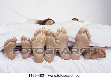 people, sleeping, bed, family, feet, brunette View Large Photo Image Stock Image - people, sleeping, bed, family, feet, brunette. Fotosearch