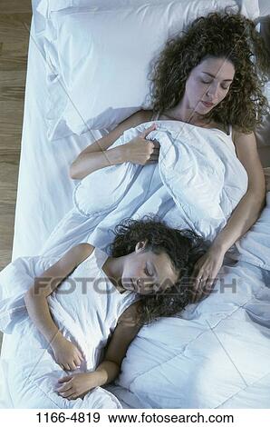 people, sleeping, mother, Hispanic, bed, family, daughter View Large Photo Image Stock Photo - people, sleeping, mother, Hispanic, bed, family, daughter. Fotosearch