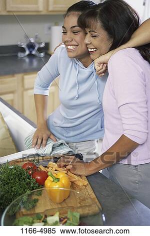Stock Photography - people, smiling, Asian, mother, sliced, cooking, knife. Fotosearch