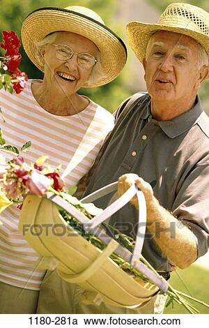 people, smiling, couple, hats, senior, gardening, basket View Large Photo Image Stock Image - people, smiling, couple, hats, senior, gardening, basket. Fotosearch