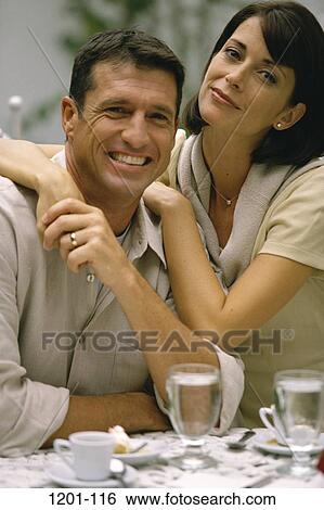 people, smiling, couple, holding, Middle-aged, dining out, beverages View Large Photo Image Stock Photograph - people, smiling, couple, holding, Middle-aged, dining out, beverages. Fotosearch