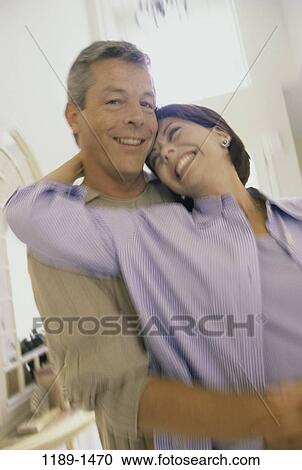 people, smiling, couple, laughing, Middle-aged, hugging, smile View Large Photo Image Stock Image - people, smiling, couple, laughing, Middle-aged, hugging, smile. Fotosearch