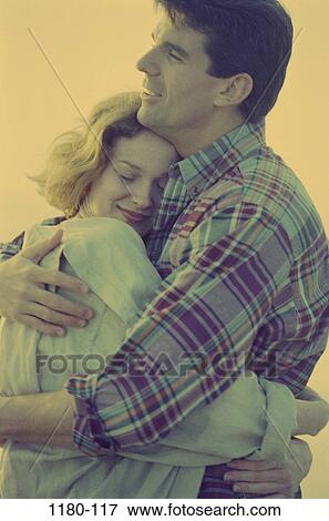 Stock Photo - people, smiling, couple, outdoors, romantic, tranquility, nurturing. Fotosearch