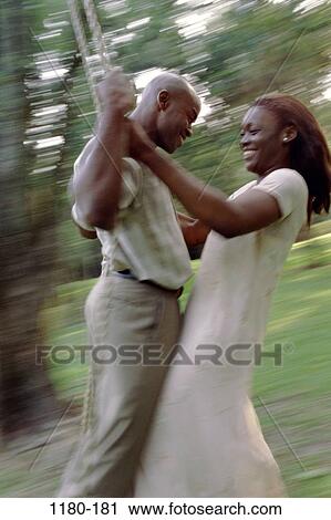 people, smiling, couple, swinging, swing, flirting View Large Photo Image Stock Image - people, smiling, couple, swinging, swing, flirting. Fotosearch