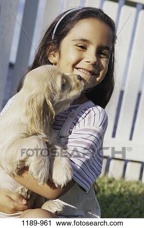people, smiling, dog, puppy, licking, pet, holding View Large Photo Image Stock Image - people, smiling, dog, puppy, licking, pet, holding. Fotosearch