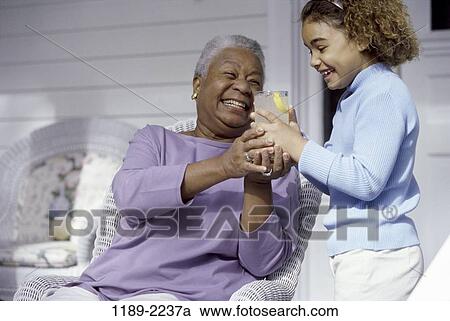 people, smiling, drinking, laughing, outdoors, lemonade View Large Photo Image Stock Image - people, smiling, drinking, laughing, outdoors, lemonade. Fotosearch