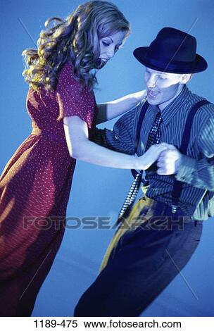 people, smiling, hat, couple, blue, dancing, swing View Large Photo Image Stock Photography - people, smiling, hat, couple, blue, dancing, swing. Fotosearch