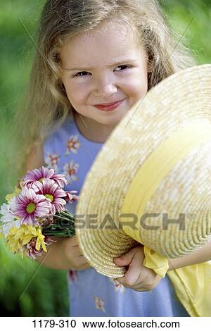 people, smiling, hat, girl, flowers, outdoors, picking View Large Photo Image Stock Image - people, smiling, hat, girl, flowers, outdoors, picking. Fotosearch