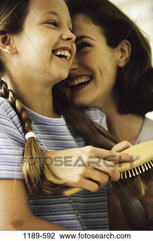 people, smiling, mother, laughing, brushing, smile, family View Large Photo Image Stock Image - people, smiling, mother, laughing, brushing, smile, family. Fotosearch