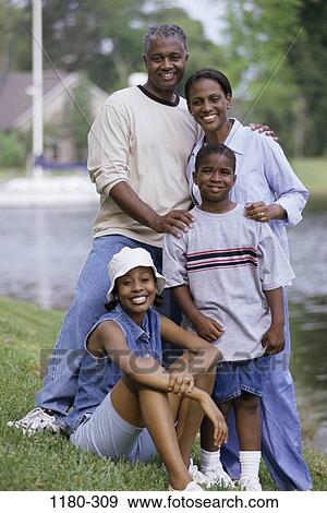 people, smiling, outdoors, smile, family, posing, portrait View Large Photo Image Stock Photo - people, smiling, outdoors, smile, family, posing, portrait. Fotosearch