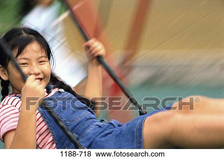people, smiling, playing, Asian, swinging, girl, swing View Large Photo Image Stock Photo - people, smiling, playing, Asian, swinging, girl, swing. Fotosearch