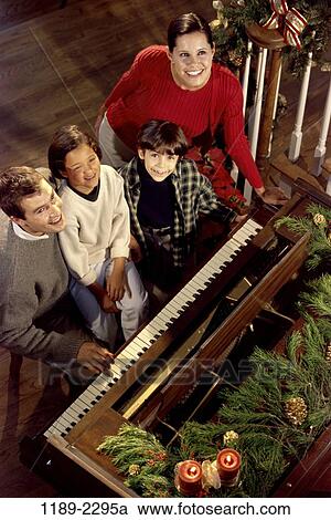 people, smiling, playing, Christmas, music, piano, tradition View Large Photo Image Stock Image - people, smiling, playing, Christmas, music, piano, tradition. Fotosearch