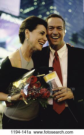 people, smiling, suit, couple, laughing, flowers, outdoors View Large Photo Image Stock Image - people, smiling, suit, couple, laughing, flowers, outdoors. Fotosearch