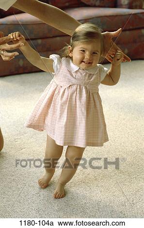 Stock Image - people, smiling, walking, baby, toddler, girl, future. Fotosearch
