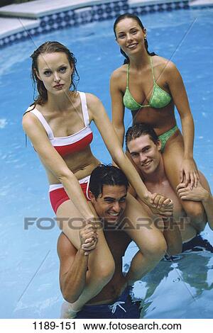 people, swim, pool, playing, swimming, riding, outdoors View Large Photo Image Stock Image - people, swim, pool, playing, swimming, riding, outdoors. Fotosearch