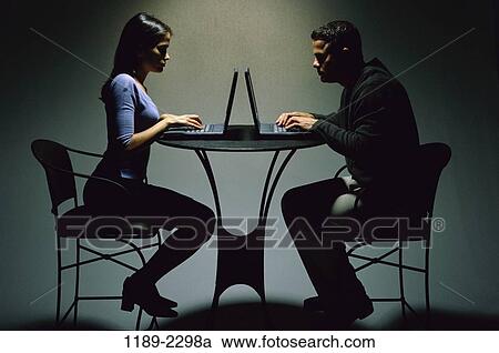 people, table, couple, Hispanic, typing, chairs, competition View Large Photo Image Stock Image - people, table, couple, Hispanic, typing, chairs, competition. Fotosearch