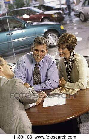 Stock Image - people, talking, couple, conversation, car, Middle-aged, cars. Fotosearch