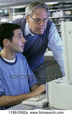 people, teacher, school, computer, library, looking, education View Large Photo Image Stock Image - people, teacher, school, computer, library, looking, education. Fotosearch