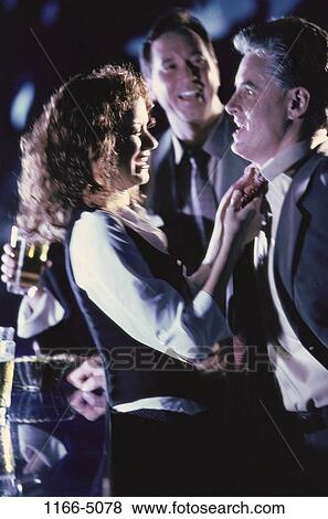Stock Photo - people, tie, smiling, beer, drinking, laughing, flirting. Fotosearch