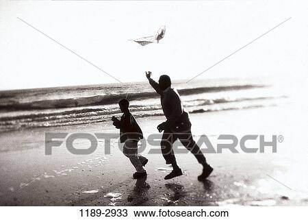 people, time, male, flying, beach, silhouette, tranquility View Large Photo Image Stock Image - people, time, male, flying, beach, silhouette, tranquility. Fotosearch