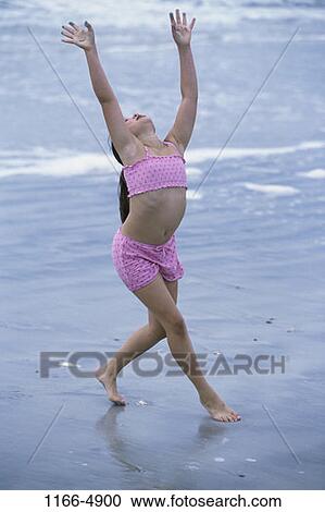 Stock Image - people, water, beach, girl, child, brunette. Fotosearch