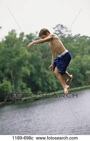 Stock Image - people, water, jump, playing, jumping, lake, boy. Fotosearch