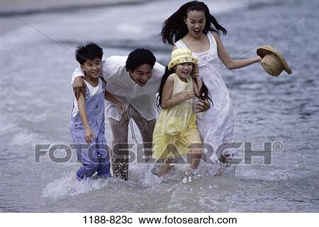 people, water, playing, Asian, beach, splash View Large Photo Image Stock Image - people, water, playing, Asian, beach, splash. Fotosearch