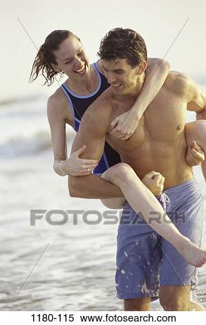Stock Photography - people, water, walking, couple, ocean, friendship, beach. Fotosearch