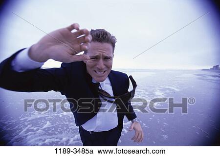people, windy, wind, beach, stress, business View Large Photo Image Stock Image - people, windy, wind, beach, stress, business. Fotosearch