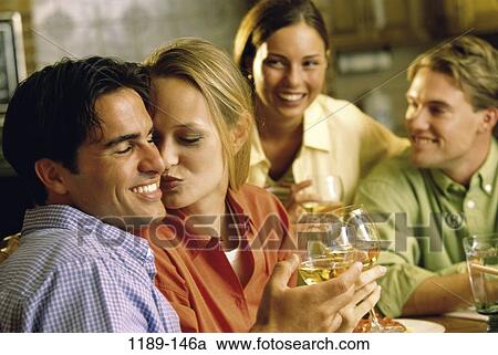 Stock Image - people, wine, drinking, romantic, friends, alcoholic. Fotosearch