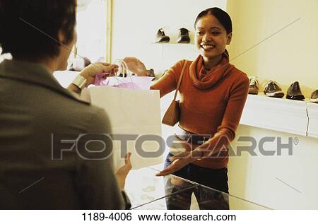 people, woman, Asian, shoes, bag, shopping View Large Photo Image Stock Photograph - people, woman, Asian, shoes, bag, shopping. Fotosearch