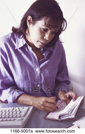 people, woman, Hispanic, Middle-aged, writing, finance, personal finance View Large Photo Image Stock Image - people, woman, Hispanic, Middle-aged, writing, finance, personal finance. Fotosearch