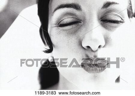 Stock Image - people, woman, Hispanic, outdoors, lips, romance. Fotosearch