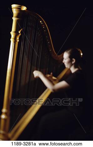 people, woman, playing, music, arts, entertainment, play View Large Photo Image Stock Image - people, woman, playing, music, arts, entertainment, play. Fotosearch