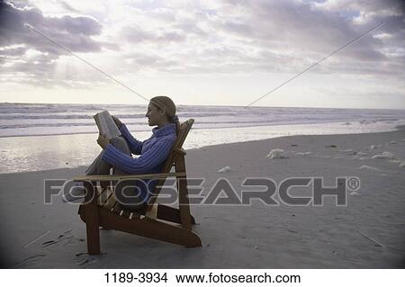 people, woman, reading, beach, book, relaxing View Large Photo Image Picture - people, woman, reading, beach, book, relaxing. Fotosearch