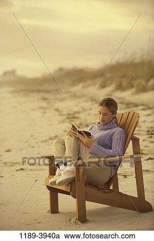 people, woman, reading, beach, book, turtleneck, clothed View Large Photo Image Stock Image - people, woman, reading, beach, book, turtleneck, clothed. Fotosearch