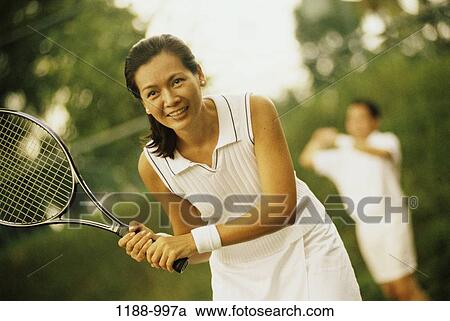 people, woman, smiling, Asian, tennis, outdoors, sports View Large Photo Image Stock Image - people, woman, smiling, Asian, tennis, outdoors, sports. Fotosearch